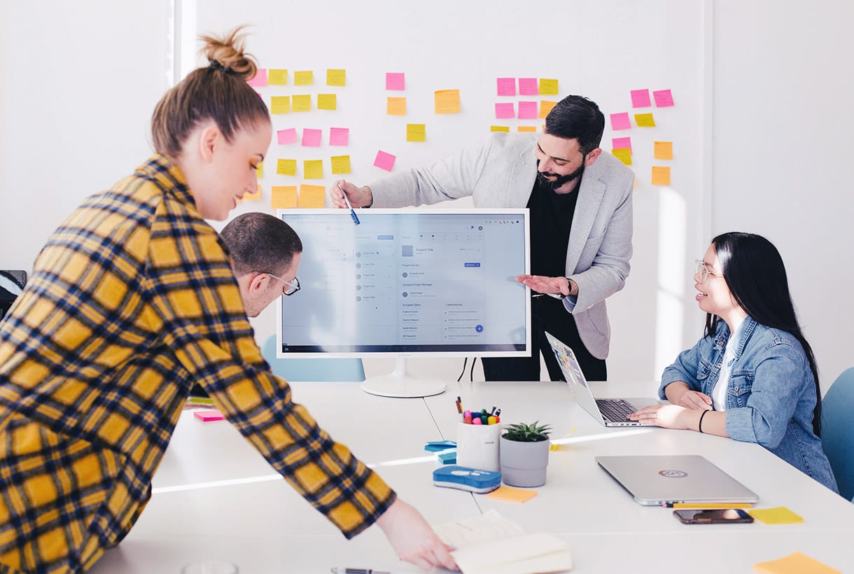 A lecturer presenting to a group of students